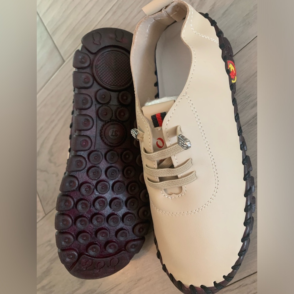 Beige Sneakers with Black Trim